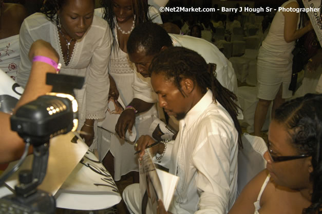 Jah Cure Signs Guest Poster - Reflections - Cure Fest 2007 - All White Birth-Night Party - Hosted by Jah Cure - Starfish Trelawny Hotel - Trelawny, Jamaica - Friday, October 12, 2007 - Cure Fest 2007 October 12th-14th, 2007 Presented by Danger Promotions, Iyah Cure Promotions, and Brass Gate Promotions - Alison Young, Publicist - Photographs by Net2Market.com - Barry J. Hough Sr, Photographer - Negril Travel Guide, Negril Jamaica WI - http://www.negriltravelguide.com - info@negriltravelguide.com...!