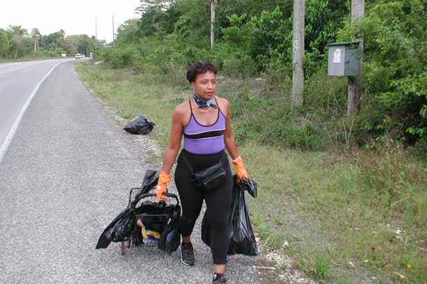 Volunteers Clean-Up Roadside Entrance to Negril - Negril Travel Guide