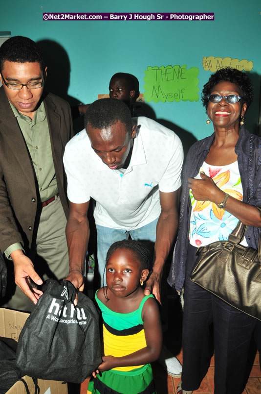 Usain Bolt of Jamaica - The Fastest Man In The World  - Usain Bolt Homecoming Celebrations - Press Conference at the Grand Bahia Principe &amp; Sherwood Content - Waldensia Primary School - Photographs by Net2Market.com - Barry J. Hough Sr. Photojournalist/Photograper - Photographs taken with a Nikon D300 - Negril Travel Guide, Negril Jamaica WI - http://www.negriltravelguide.com - info@negriltravelguide.com...!